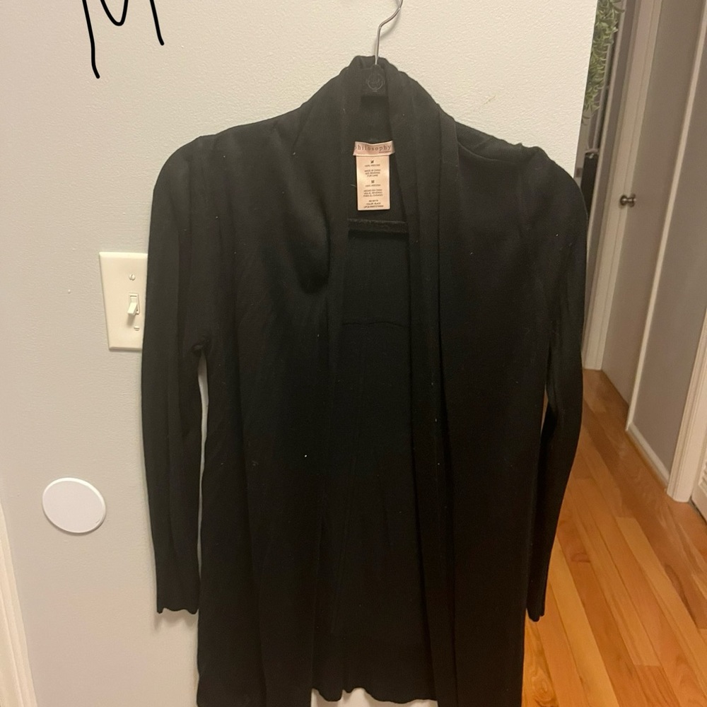 Both medium. One black. One grey. Neither worn. Sold together